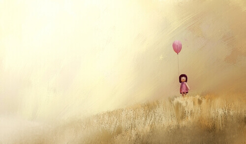 Menina com balão rosa