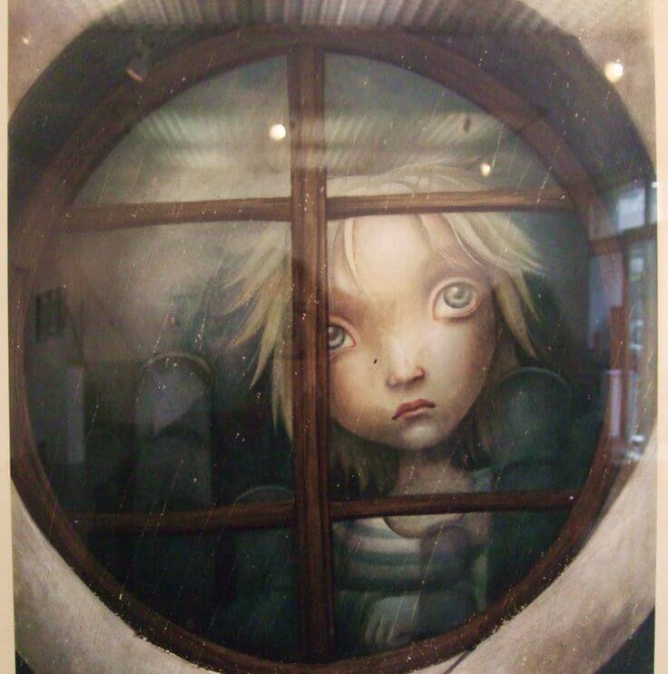 Criança triste atrás da janela