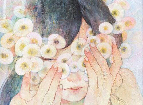 Mulher com flores redondas no rosto