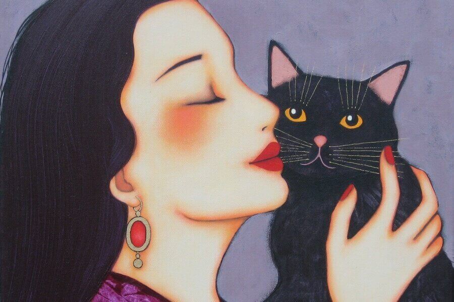 mulher abraçando gato