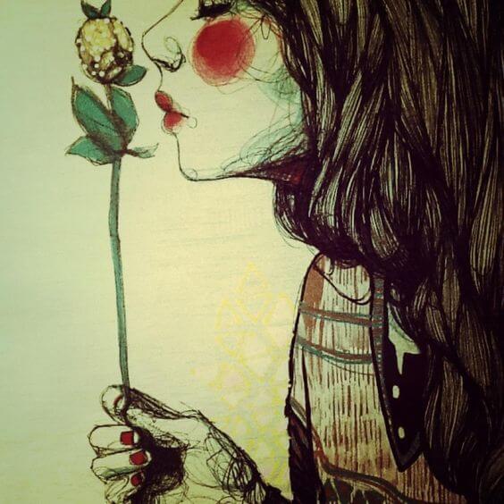 menina-cheirando-flor