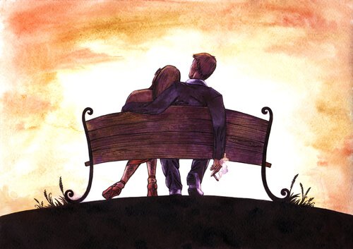 Casal-sentado-em-um-banco Por que o amor nos fascina tanto?