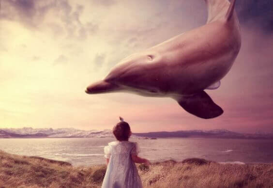 crianca-vendo-golfinho-voando