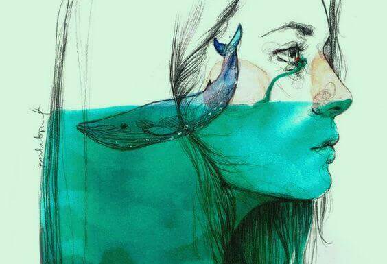 perfil-mulher-com-baleia-em-mar