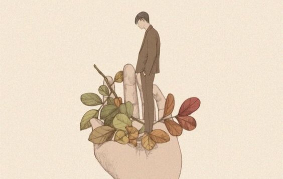 Homem em mão com folhas coloridas