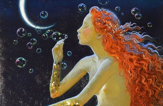 Sereia soprando bolinhas de sabão