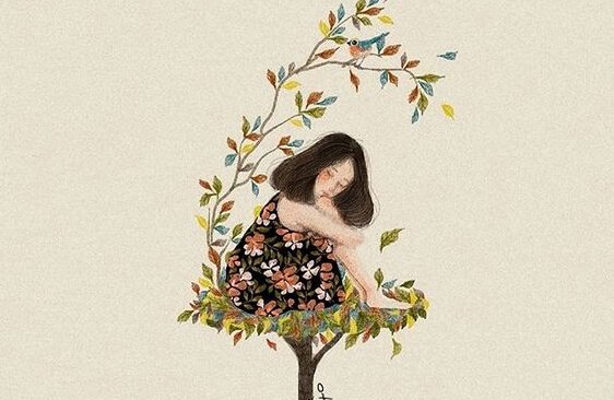 Menina sentada em ninho de folhas