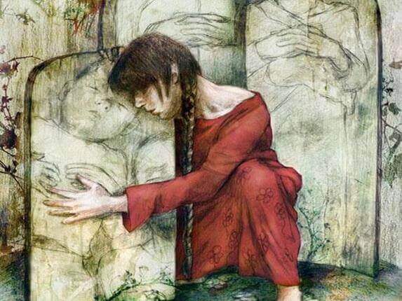 Mulher abraçando pedra com criança desenhada