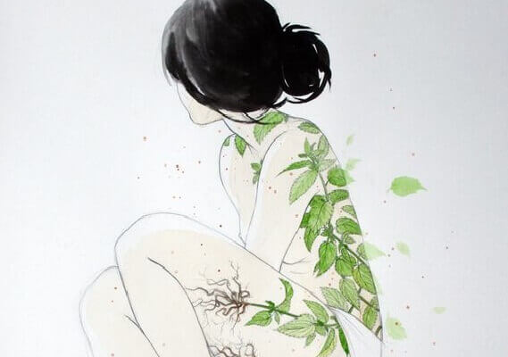 Mulher com folhas verdes no corpo