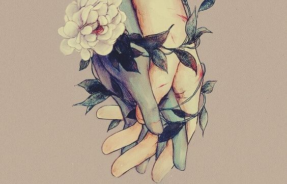 Mãos entrelaçadas com flores e folhas
