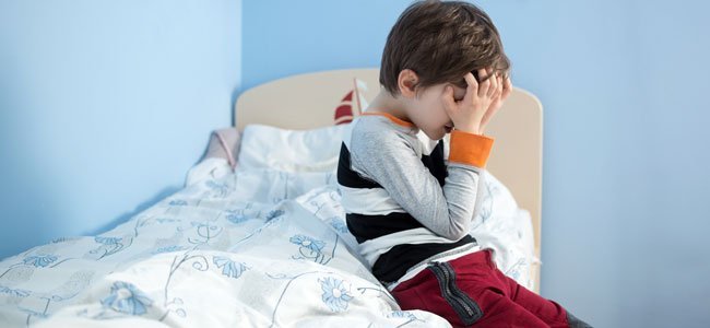 Criança doente em sua cama