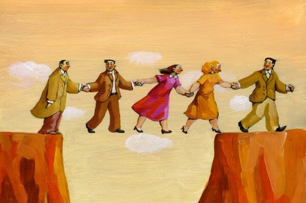 Pessoas cruzando penhasco juntas